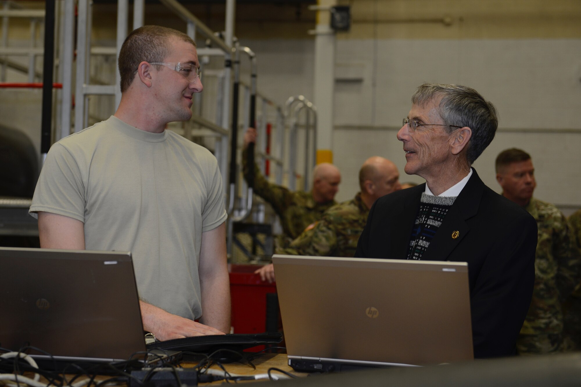 Acting Secretary of the Army Robert M. Speer speaks with a 128th Aviation Brigade Advanced Individual Training student during a tour at Joint Base Langley-Eustis, Va., March 17, 2017. During the tour, Speer spoke with students about the technology and tools they use for training. (U.S. Air Force photo/Airman 1st Class Kaylee Dubois)