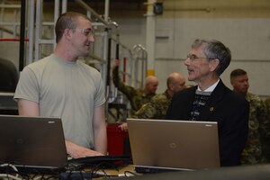 Acting Secretary of the Army Robert M. Speer speaks with a 128th Aviation Brigade Advanced Individual Training student during a tour at Joint Base Langley-Eustis, Va., March 17, 2017. During the tour, Speer spoke with students about the technology and tools they use for training. (U.S. Air Force photo/Airman 1st Class Kaylee Dubois)