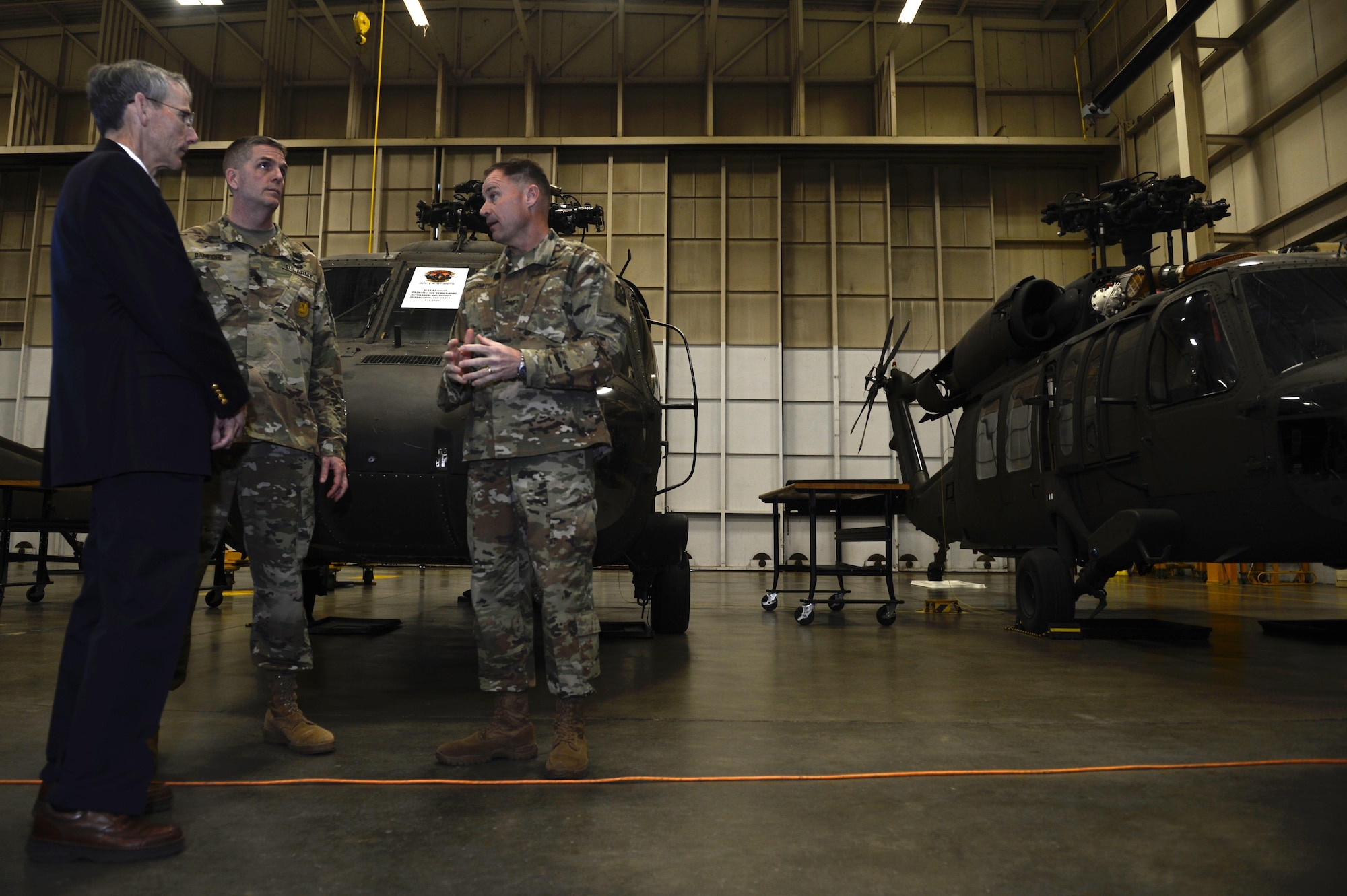 Acting Secretary of the Army Robert M. Speer speaks with U.S. Army Col. John Smith, 128th Aviation Brigade commander, and U.S. Army Lt. Col. Thomas Bamford, 2nd Battalion, 128th Avn. Bde. Commander, during a tour at Joint Base Langley-Eustis, Va., March 17, 2017. Throughout his visit to the brigade, Speer focused on students and hearing first-hand their experiences with Advanced Individual Training school. (U.S. Air Force photo/Airman 1st Class Kaylee Dubois)