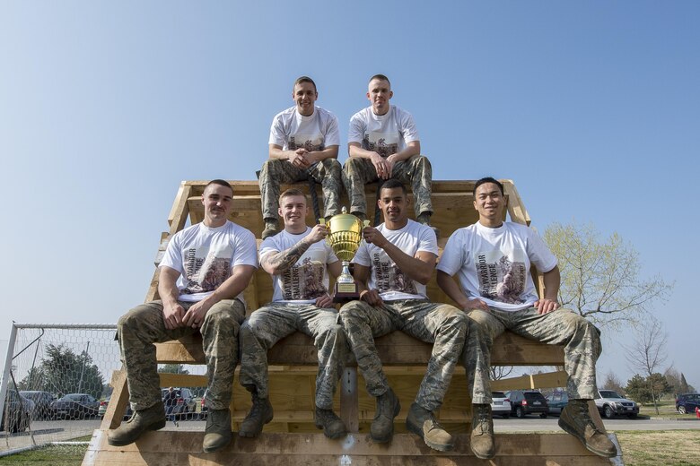31st Communications Squadron Airmen pose with their championship trophy after the first Combat Warrior Challenge, March 16, 2017, at Aviano Air Base. Eight teams of Airmen representing squadrons from the 31st Fighter Wing participated in the four-day competition. (U.S. Air Force photo by Senior Airman Cory W. Bush)