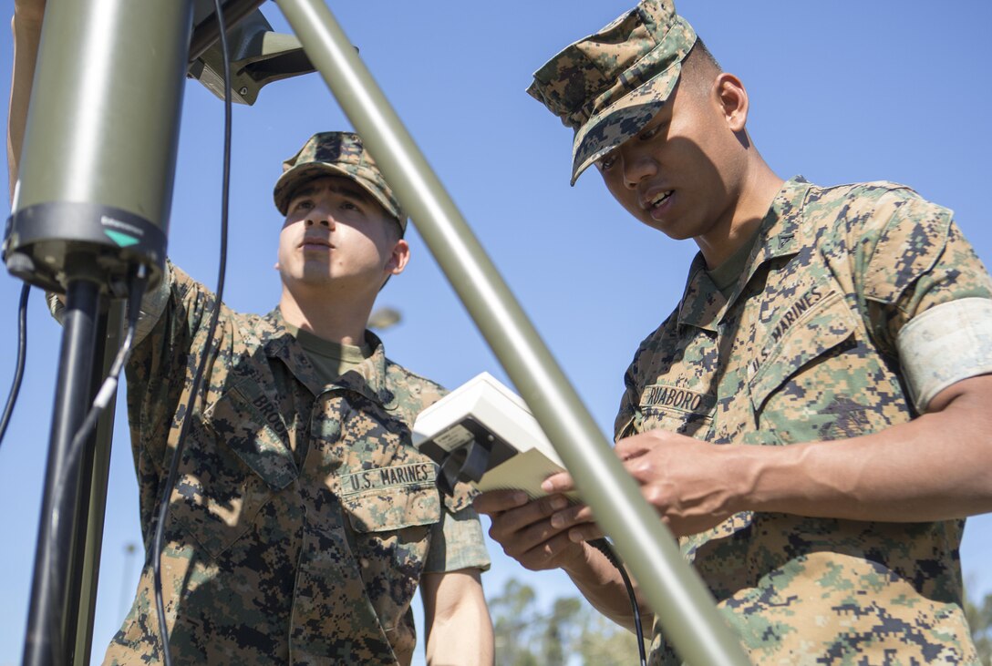 Cpl. Timothy Brooks (left) and Lance Cpl. Christopher Ruaboro, meteorological and oceanographic (METOC) forecasters with Battle Space and Surveillance Company, 1st Intelligence Battalion, I Marine Expeditionary Force, use the automated weather operating system to record weather observations for their weekly, 24-hour METOC observer certification exercise at Marine Corps Base Camp Pendleton, Mar 14, 2017. The weather forecasts provided by the METOC Marines assist commanders in air, sea or ground operations. Brooks is a native of Rockville, Maryland, and Ruaboro is a native of Lihue, Hawaii. (U.S. Marine Corps photo by Lance Cpl. Justin Bowles)