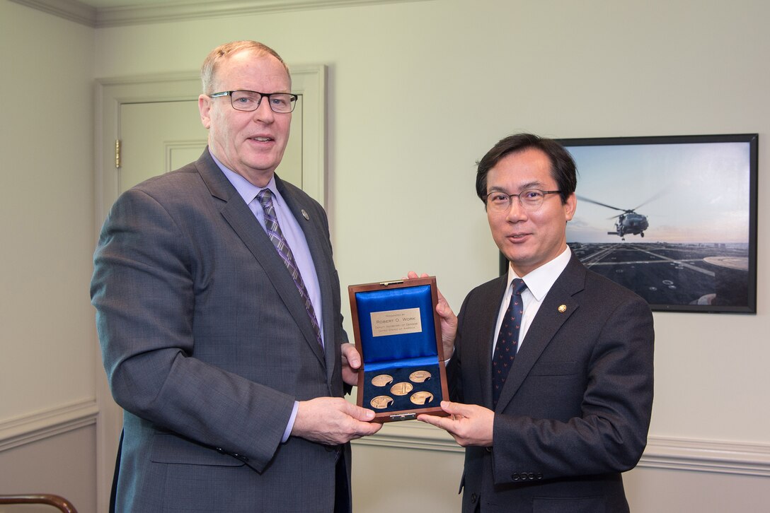 Deputy Defense Secretary Bob Work presents a gift to Kim Young-woo, chairman of the National Assembly Committee on National Defense of South Korea, after a meeting at the Pentagon, March 22, 2017. DoD photo by Army Sgt. Amber I. Smith