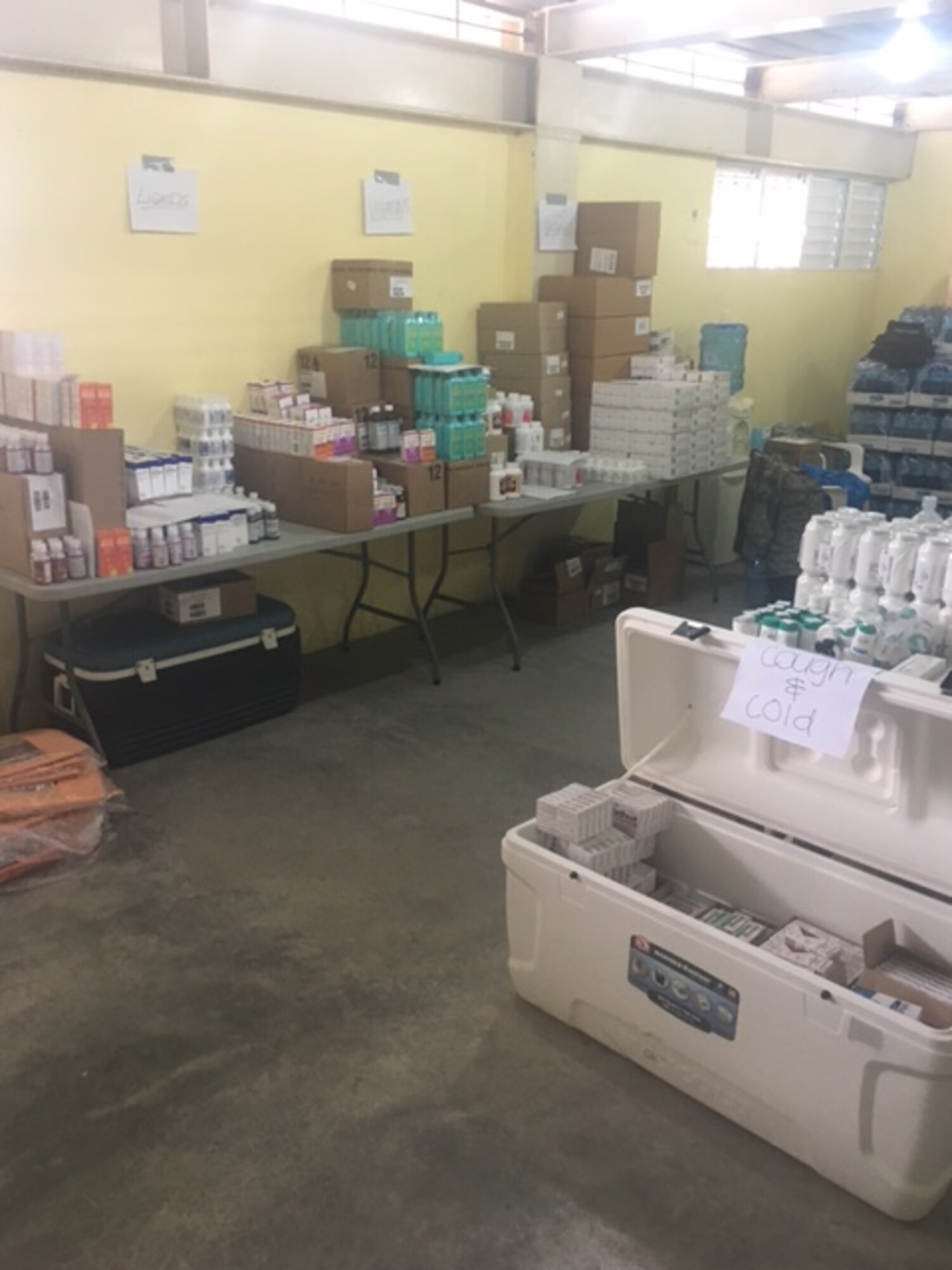 Capt. (Dr.) Bruce Abbott, 460th Medical Group pharmacy element chief, and Staff Sgt. Danielle Garcia, 460th MDG pharmacy tech, organized all of the medications in the pharmacy as soon as they arrived in the Dominican Republic. Abbott and Garcia saw 5,753 patients and dispensed over 8,000 prescriptions in the eight days that clinic was open. (Courtesy photo)