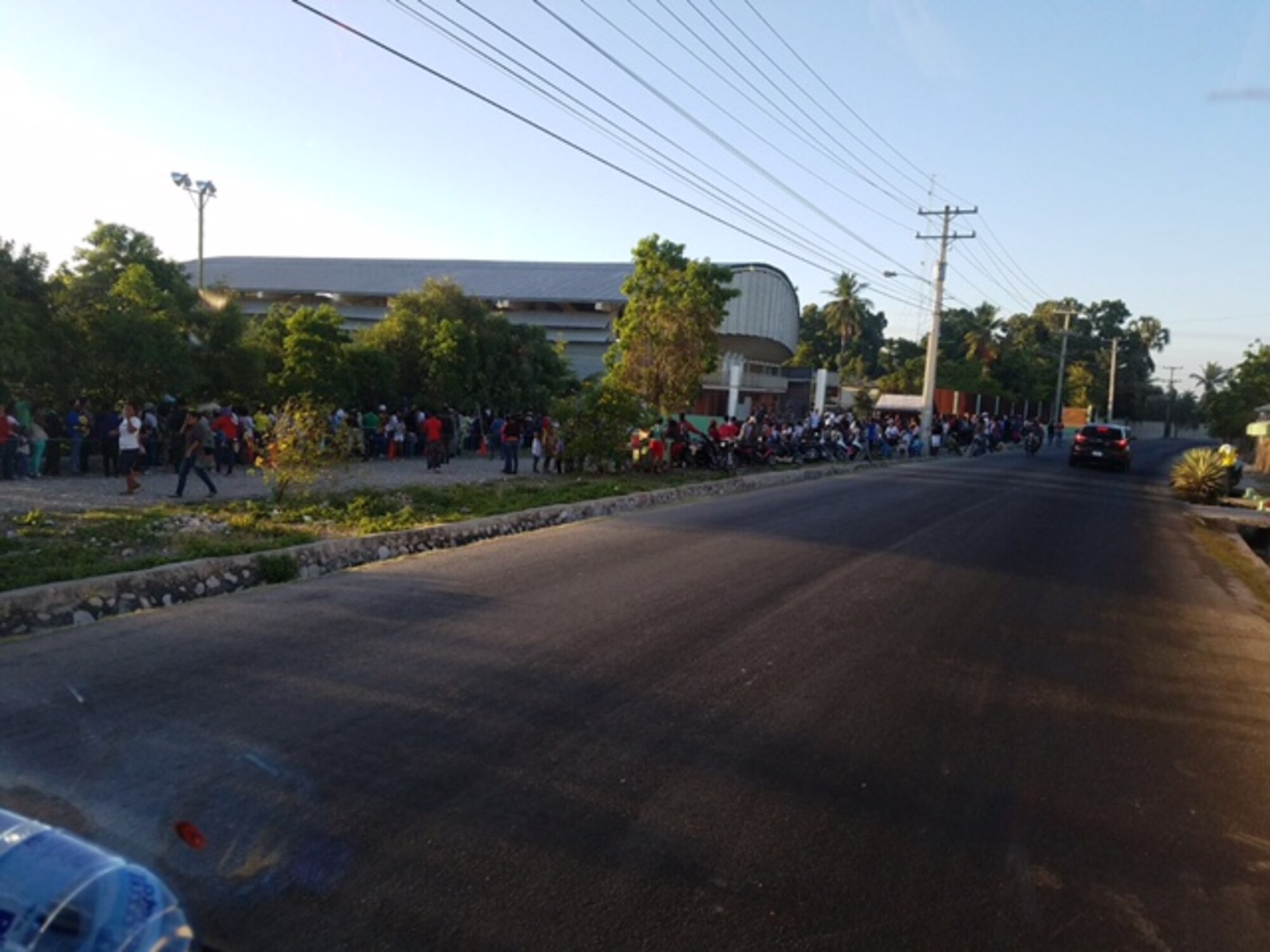 Every morning while Capt. (Dr.) Bruce Abbott, 460th Medical Group pharmacy element chief, and Staff Sgt. Danielle Garcia, 460th MDG pharmacy tech, were deployed to the Dominican Republic, the line of patients extended down the street. The services Abbott and Garcia provided were needed badly enough that patients would start lining up at the clinic at 9 p.m. the night before. (Courtesy photo)