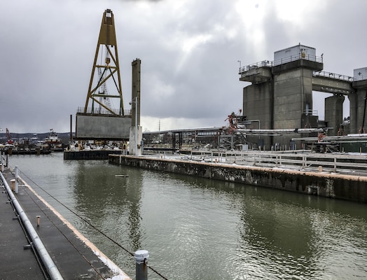 The precast, 115-tons culverts were brought in and lowered into place using a large A-frame crane. The 12-ft-high by 14-ft-wide by 34.5-ft-long precast culverts are stay-in elements within the new middle wall that will allow the future landside lock chamber to empty water from the chamber into the river.