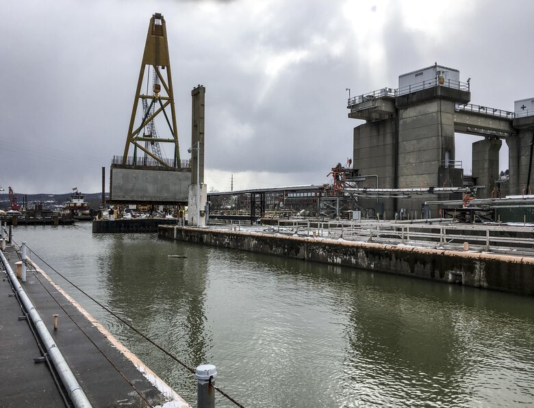 The precast, 115-tons culverts were brought in and lowered into place using a large A-frame crane. The 12-ft-high by 14-ft-wide by 34.5-ft-long precast culverts are stay-in elements within the new middle wall that will allow the future landside lock chamber to empty water from the chamber into the river.