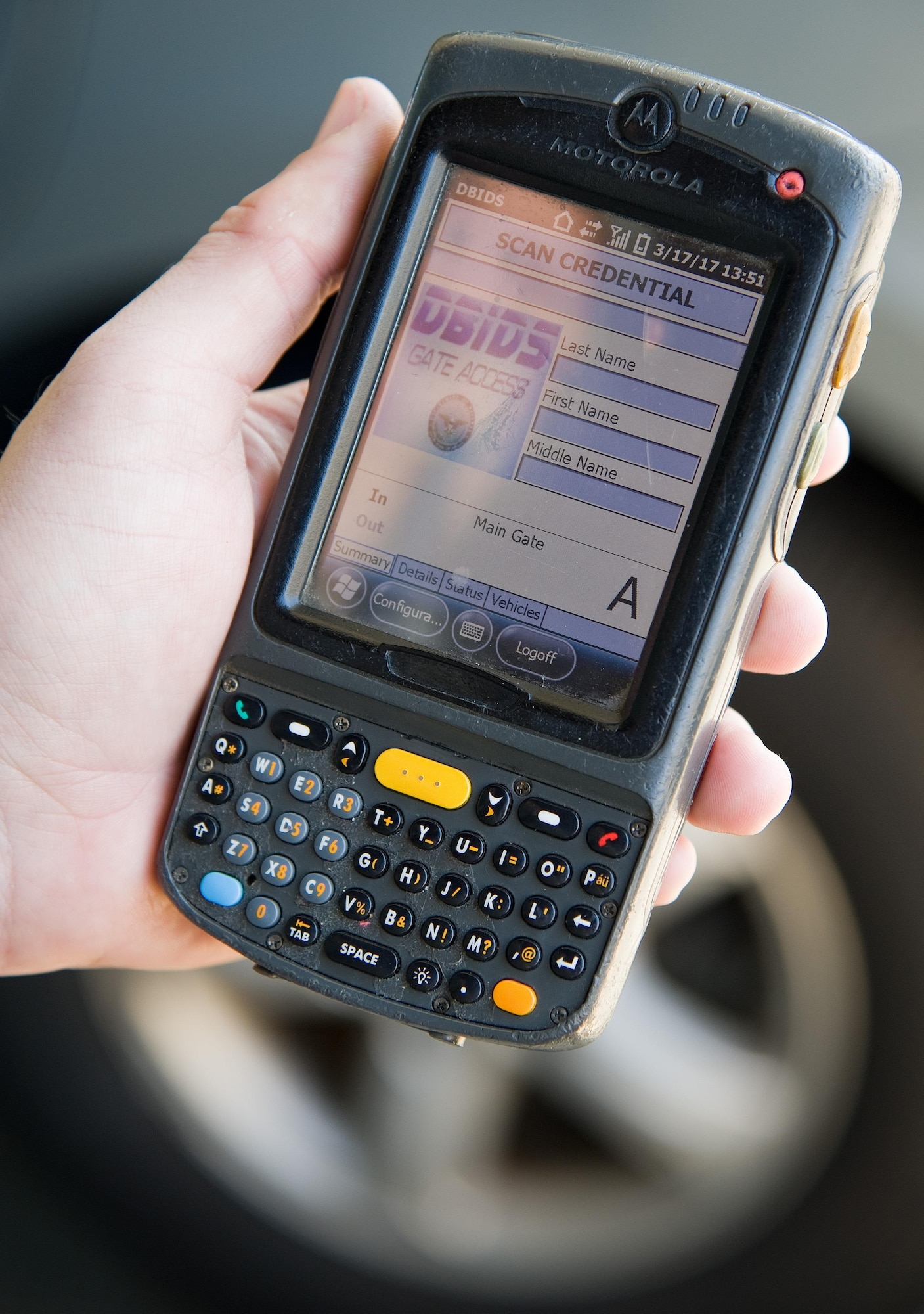 Senior Airman Joshua Olsen, 436th Security Forces Squadron response force leader, prepares to use a hand-held Defense Biometrics Identification System scanner to check the validity of Department of Defense identification cards of personnel entering the main gate March 17, 2017, on Dover Air Force Base, Del. Scheduled to be implemented in May of this year, new DBIDS 5.0 scanners will allow SFS personnel to check IDs more rapidly at all entry points. (U.S. Air Force photo by Roland Balik)