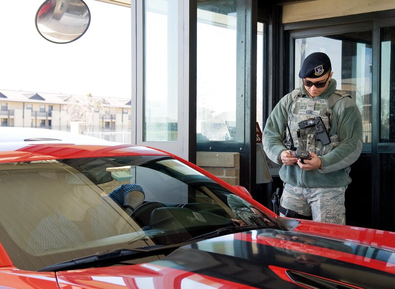 Airman 1st Class Vincent Leal, 436th Security Forces Squadron response force member, uses a hand-held Defense Biometrics Identification System scanner to validate Common Access Card information of an individual entering the main gate March 17, 2017, on Dover Air Force Base, Del. A monthly average of more than 270,000 scans are conducted by 436th SFS personnel at the base’s three gates. Scheduled to be implemented in May of this year, new DBIDS 5.0 scanners will allow SFS personnel to check IDs more rapidly at all entry points. (U.S. Air Force photo by Roland Balik)