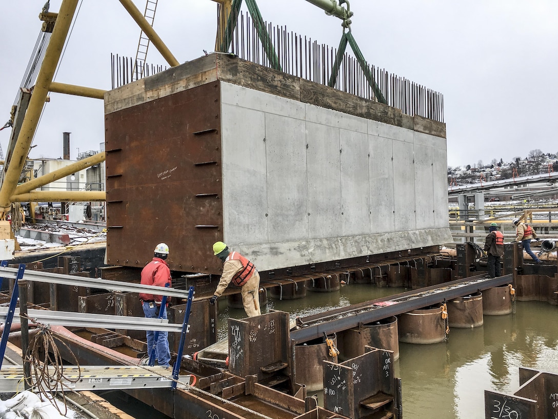 The $70.5 million work on monoliths M22 to M27 is part of the $2.7-billion Lower Monongahela Locks and Dams 2, 3, 4, or Lower Mon Project. The work underway at Charleroi involves building new middle and river walls that comprise a new riverside lock chamber.