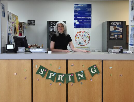 Sharon McCrea, Malmstrom Air Force Base postmaster, poses at the counter of the base contract postal unit March 21, 2017, at Malmstrom Air Force Base, Mont. McCrea has been running the post office as a one-woman shop for eight months. (U.S. Air Force photo/Senior Airman Jaeda Tookes)