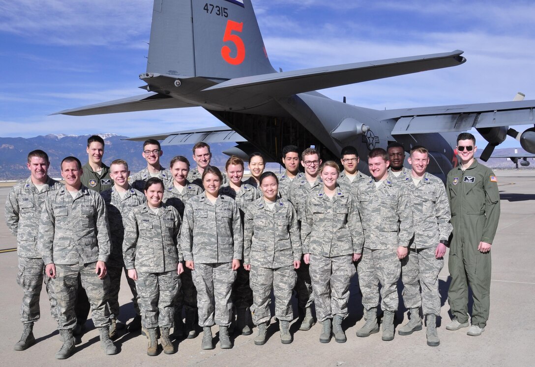 Air Force ROTC cadets from Colorado State University pose in front of a C-130 Hercules for a group photo during a tour at Peterson Air Force Base, Colorado, March, 15 2017. The cadets were able to board the C-130 and fly as passengers during a proficiency training mission. (Air Force photo/Staff Sgt. Frank Casciotta) 