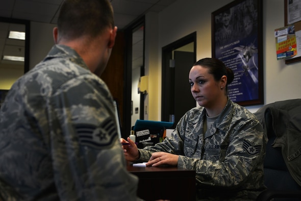 U.S. Air Force Staff Sgt. Rachael Phillips, 20th Force Support Squadron reenlistments noncommissioned officer in charge, helps a customer at Shaw Air Force Base, S.C., March 20, 2017. The reenlistments office of the military personnel section helps service members to extend, reenlist and receive any bonuses they may be entitled to upon reenlistment. (U.S. Air Force photo by Airman 1st Class Destinee Sweeney)