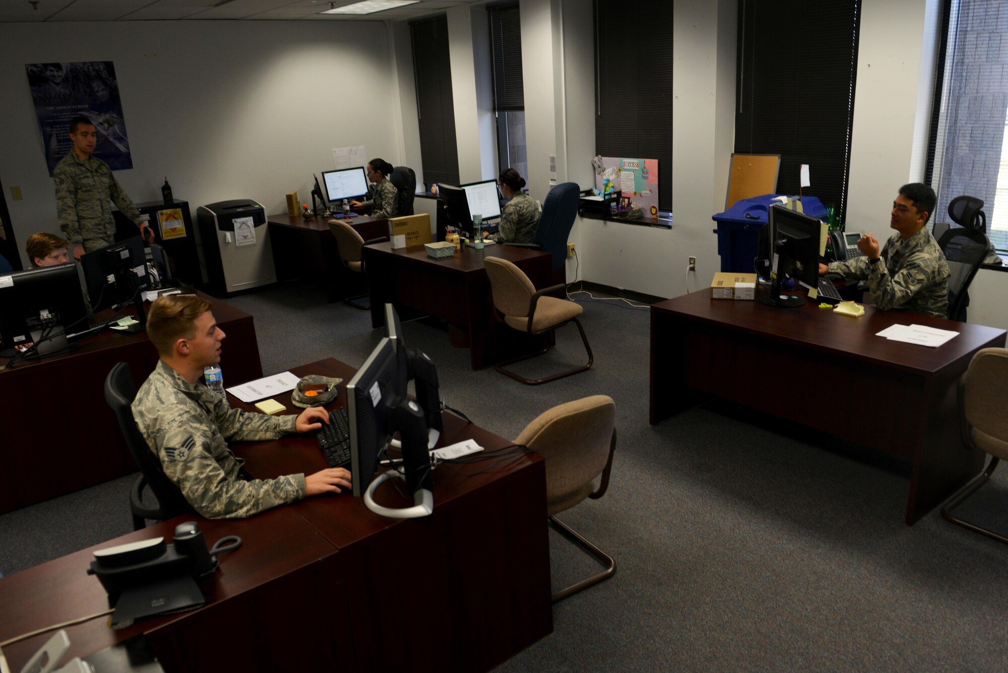 U.S. Airmen assigned to the 20th Force Support Squadron evaluations office work on enlisted performance report (EPR) packages at Shaw Air Force Base, S.C., March 20, 2017. The evaluations Airmen are responsible for reviewing and submitting EPRs to the Air Force Personnel Center. (U.S. Air Force photo by Airman 1st Class Destinee Sweeney)