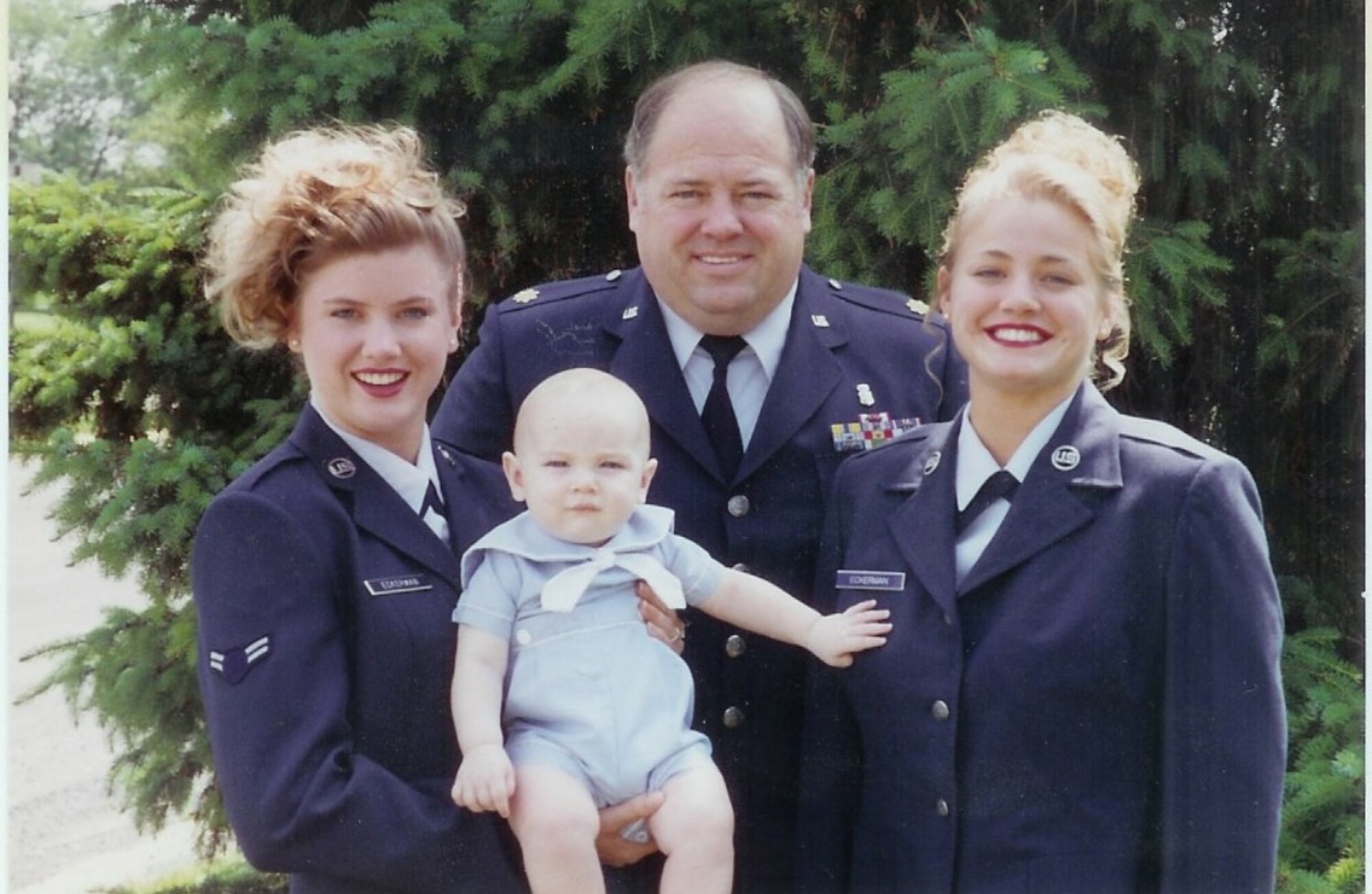 Sisters Rachelle Amado (left) and Heather Braundmeier (right), pictured in 1994 with their younger brother Donald Eckerman, followed in the footsteps of their father, Joseph Eckerman, by joining the military(Courtesy Photo) 