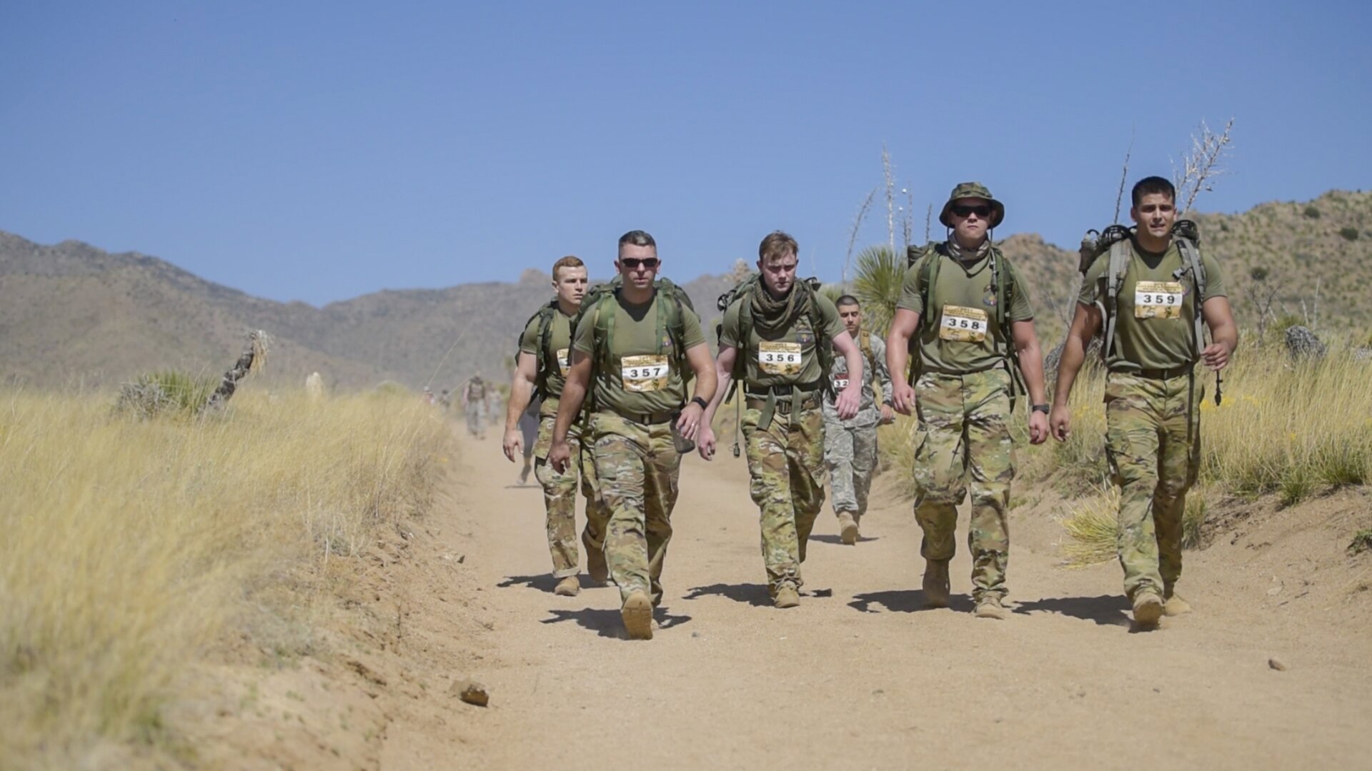 Soldiers for Company D. 1-151 Infantry competing in the heavy division cross the mile 13 marker of the Bataan Memorial Death March. Pictured from left, Spc. Justin Stuart, Sgt. 1st Class Josh Chenault, Spc. Blade Cain, Spc. Adam Freese and Sgt. Ryan O’Donnell. 