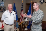 Lt. Gen. Darryl Roberson, commander of Air Education and Training Command, and Dr. Joe Leverett , provided background information on the significance of the Altus Trophy during the AETC Commander’s Civic Leader Group tour March 22, 2017, at Joint Base San Antonio-Randolph, Texas.  The trophy is presented annually to the community judged to have provided the top support to an AETC base. (U.S. Air Force photo by Sean Worrell)
