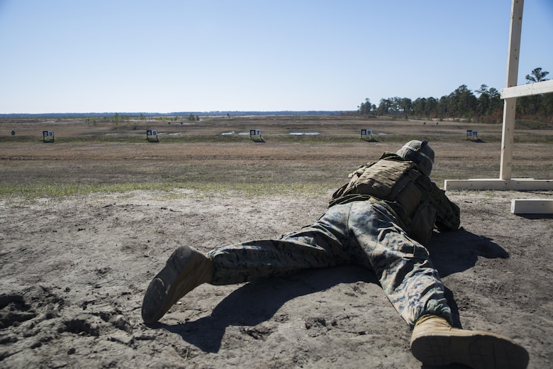 Sgt. Daniel Grant, a mortarman with Special Purpose Marine Air-Ground Task Force - Southern Command, assumes the prone position while firing at an unknown distance target on a Table 3 range during pre-deployment training at Range K501 aboard Marine Corps Base Camp Lejeune, North Carolina, March 16, 2017.  The training was conducted to enhance the Ground Combat Element’s readiness for future security cooperation operations in Central America. (U.S. Marine Corps photo by Cpl. Melissa Martens/ Released)