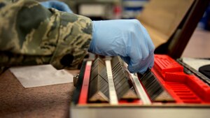 U.S. Air Force Senior Airman Ruben Mejia, 1st Maintenance Squadron precision measurement equipment laboratory technician, uses gauge blocks to calibrate linear measurement tools at Joint Base Langley-Eustis, Va., March 17, 2017. The PMEL flight is divided in two main sections, electrical standards and physical dimensions, to support its customers. (U.S. Air Force photo/Senior Airman Areca T. Bell)