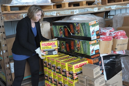 Sara Podwika, 502 Civil Engineer Squadron, U-Fix-It store supply leader, stocks and organizes supplies which are available and can be checked out for self-help projects, March 21, at Joint Base San Antonio-Randolph. The U-Fix-It store has a variety of tools and garden supplies which are available for self-help projects at Joint Base San Antonio-Randolph.(U.S. Air Force photo by Joel Martinez) 