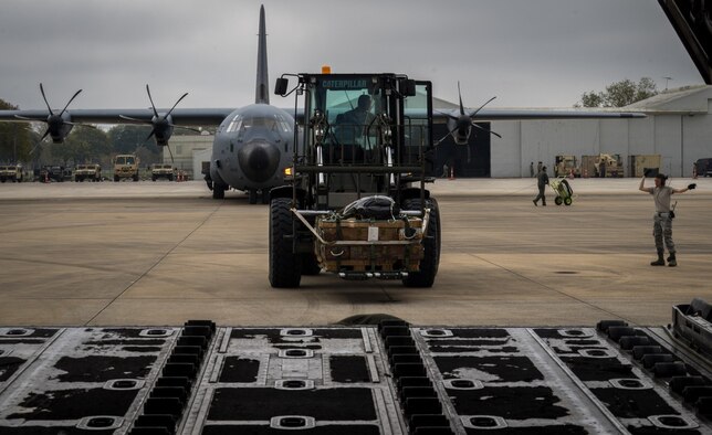 Airmen load a pallet of supplies onto a C-130J Super Hercules aircraft during the Green Flag Little Rock 17-05 exercise March 19 iin Alexandria, Louisiana. The supplies were for U.S. Army troops participating in the deployment simulation. (U.S. Air Force photo/Staff Sgt. Shelton Sherrill)
