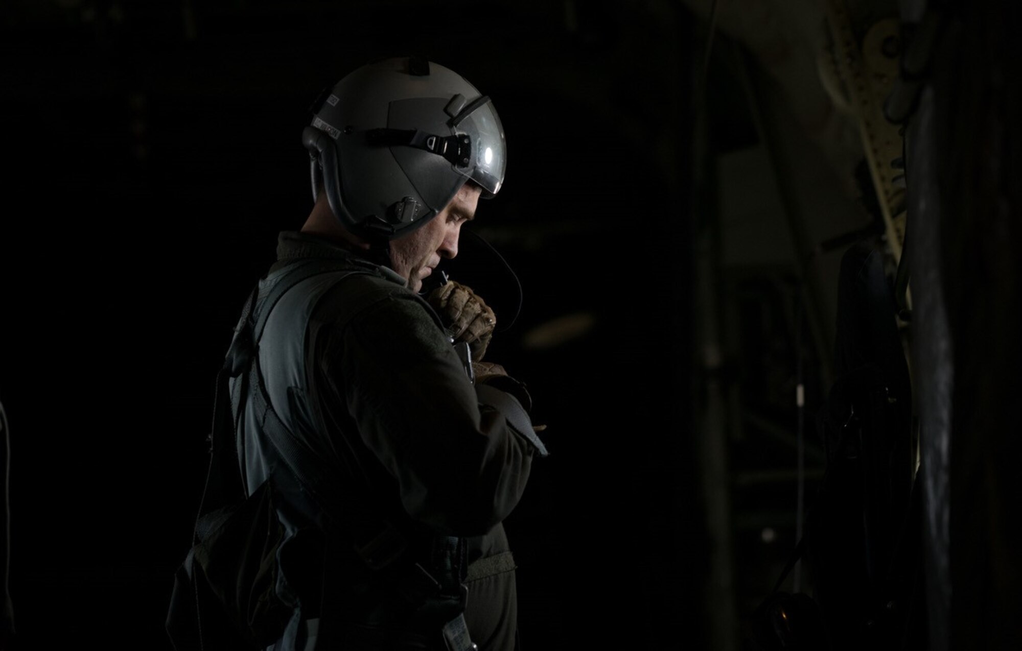 Tech. Sgt. Jonathan Packer, 815th Airlift Squadron,  secures his harness before an airdrop during the Green Flag Little Rock 17-05 exercise March 19 in Alexandria, Louisiana.(U.S. Air Force photo/Staff Sgt. Shelton Sherrill)