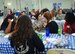 Air Force Reserve Command Chief Master Sgt. Ericka Kelly (front table) and Chief Master Sgt. Wendy Blevins, Directorate of logistics, Engineering and Force Protectionchief enlisted manager (rear table) speak with students at the 10th Annual Joint Base Charleston Women in Aviation Career Day March 20 at Joint Base Charleston, S.C.