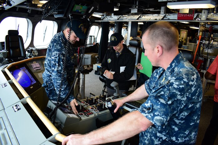 170313-N-VV532-002  PACIFIC OCEAN (March 13, 2017) Lt. j.g. John Homola demonstrates the ship control console functionality to a Board of Inspection and Survey (INSURV) inspector during final contract trials for littoral combat ship USS Montgomery (LCS 8). Montgomery is the fourth littoral combat ship of the Independence variety which features an innovative trimaran hull, designed to offer unparalleled stability for marine and aviation operations in severe sea states.  (U.S. Navy photo by Electronics Technician 1st Class Adam Ross/Released)