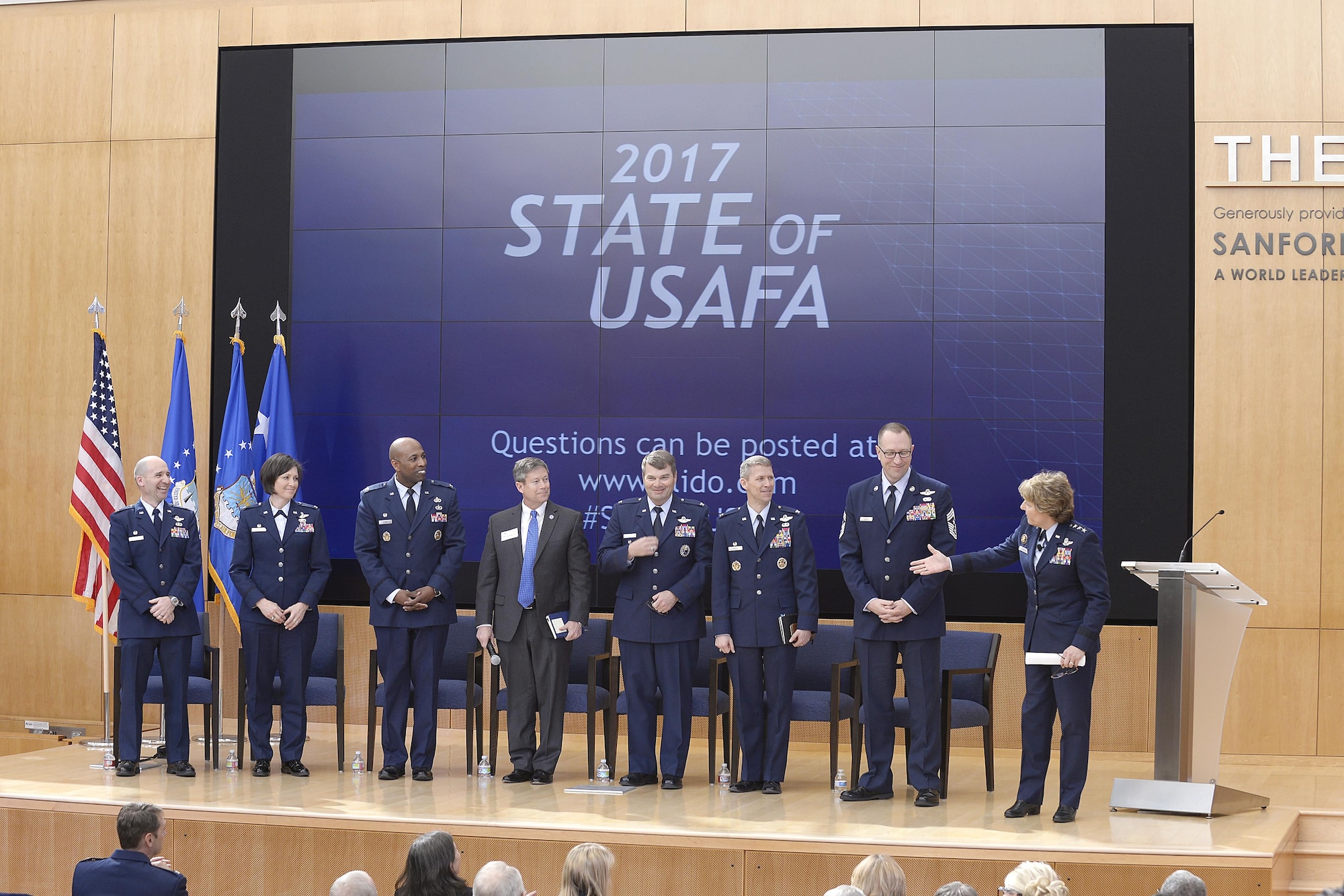 Lt. Gen. Michelle Johnson, the superintendent of the U.S. Air Force Academy, introduces seven senior Academy officials during her March 22, 2016, State of USAFA forum in Polaris Hall. The forum is an annual event updating civic leaders, the news media and industry partners, on the school’s state of affairs and future plans. (U.S. Air Force photo/Mike Kaplan)