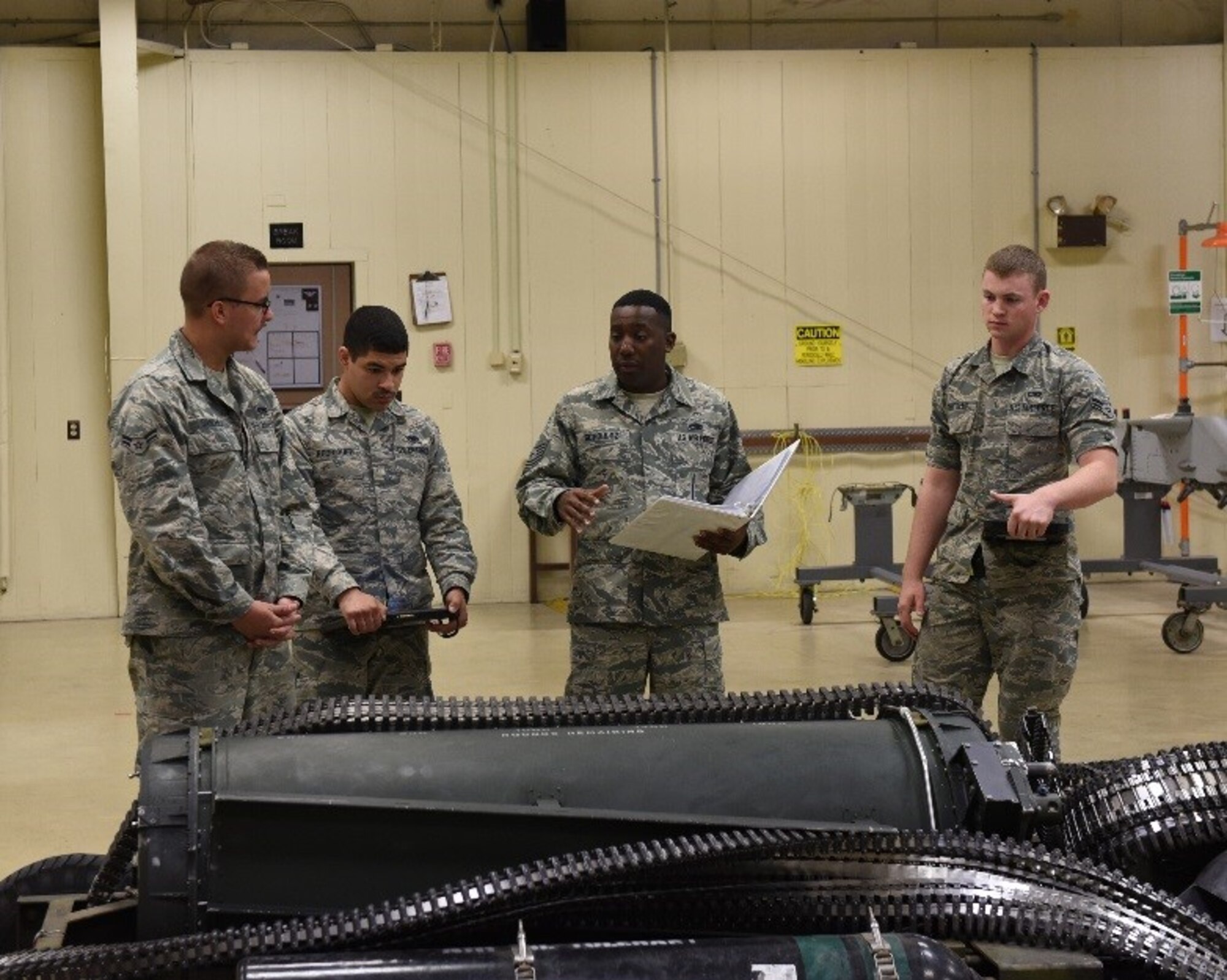U.S Air Force Tech. Sgt. Tavaras Schoultz, 372nd Training Squadron Detachment 4 instructor, evaluates his students on proper weapons systems maintenance at Tyndall Air Force Base, Fla., March 16, 2017. Schoultz was presented with the 2016 Instructor of the Year award at the Maintenance Professional of the Year awards ceremony in February. (U.S. Air Force photo by Airman 1st Class Cody R. Miller/Released) 