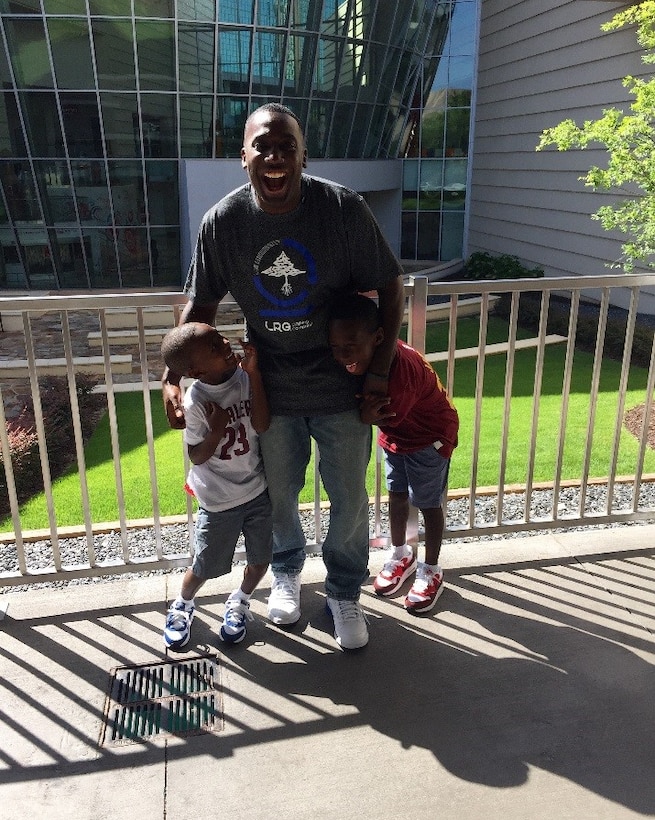 U.S. Air Force Tech Sgt. Tavaras Schoultz, 372nd Training Squadron Detachment 4 instructor, poses for a picture with his two sons. Schoultz believes staying involved with his family and coaching his children are some of the most important things he can do as a father. (Courtesy Photo) 