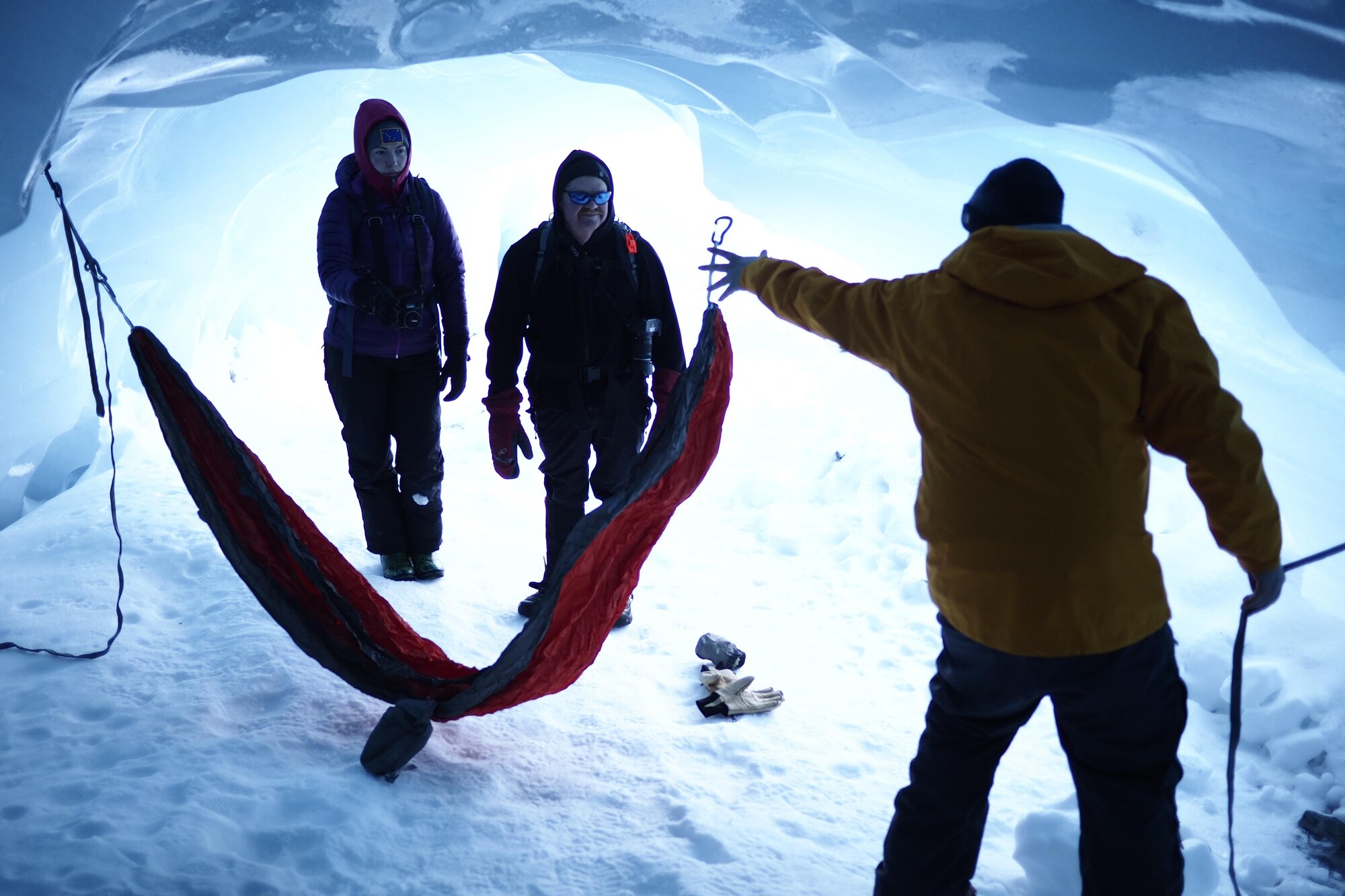 Dana Rosso, 673d Air Base Wing Public Affairs community engagement section chief, sets up a hammock inside of Byron Glacier at Girdwood, Alaska, March 12, 2017. Residents of Joint Base Elmendorf-Richardson with a hunger for adventure can find all necessary cold weather gear at the Outdoor Recreation Center on base. 