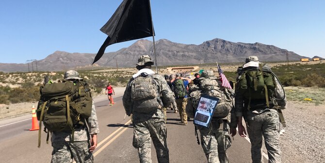 U.S. Air Force Airmen from the 23d Security Forces Squadron at Moody Air Force Base, Ga., march during the Bataan Memorial Death March, March 19, 2017, at White Sands Missile Range, N.M. Staff Sgt. Max Biser, 23d SFS NCO in charge of confinement, marched 26.2 miles to honor his grandfather, retired U.S. Army Sgt. Maj. Ricardo Plana and thousands more prisoners of war, who were forced to march 70 miles before entering concentration camps during WWII. (courtesy photo)