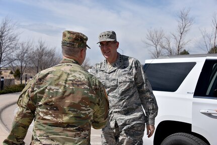 U.S. Army Lt. Gen. James H. Dickinson (left), commander of Joint Functional Component Command for Integrated Missile Defense (JFCC-IMD), greets U.S. Air Force Gen. John E. Hyten, commander of U.S. Strategic Command (USSTRATCOM), during his recent trip to Schriever Air Force Base, Colo., March 21, 2017. During the visit, his first as USSTRATCOM commander, Hyten received a tour and mission briefings from JFCC-IMD leadership. One of nine Department of Defense unified combatant commands, USSTRATCOM has global strategic missions assigned through the Unified Command Plan that include strategic deterrence; space operations; cyberspace operations; joint electronic warfare; global strike; missile defense; intelligence, surveillance and reconnaissance; and analysis and targeting.