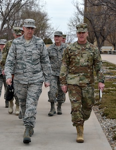 U.S. Air Force Gen. John E. Hyten (left), commander of U.S. Strategic Command (USSTRATCOM), speaks with U.S Army Lt. Gen. James H. Dickinson (right), commander of Joint Functional Component Command for Integrated Missile Defense (JFCC-IMD), during his trip to Schriever Air Force Base, Colo., March 21, 2017. During the visit, his first as USSTRATCOM commander, Hyten received a tour and mission briefings from JFCC-IMD leadership. One of nine Department of Defense unified combatant commands, USSTRATCOM has global strategic missions assigned through the Unified Command Plan that include strategic deterrence; space operations; cyberspace operations; joint electronic warfare; global strike; missile defense; intelligence, surveillance and reconnaissance; and analysis and targeting.