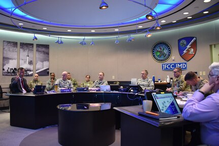 U.S. Air Force Gen. John E. Hyten (at table, fourth from left), commander of U.S. Strategic Command (USSTRATCOM), receives a Joint Functional Component Command for Integrated Missile Defense (JFCC-IMD) mission briefing from Richard Yu (left), technical director for JFCC-IMD, during Hyten’s trip to Schriever Air Force Base, Colo., March 21, 2017. This was Hyten’s first visit to JFCC-IMD as the USSTRATCOM commander. One of nine Department of Defense unified combatant commands, USSTRATCOM has global strategic missions assigned through the Unified Command Plan that include strategic deterrence; space operations; cyberspace operations; joint electronic warfare; global strike; missile defense; intelligence, surveillance and reconnaissance; and analysis and targeting.  