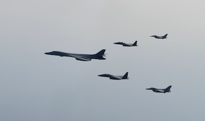 A U.S. Air Force B-1B Lancer flies in formation with South Korean F-15K Slam Eagles and F-16 Fighting Falcons in the vicinity of the South Korea, March 21, 2017. The sortie was carried out as part of U.S. Pacific Command's continuous bomber presence mission. Air Force photo by Senior Airman Daniel Robles