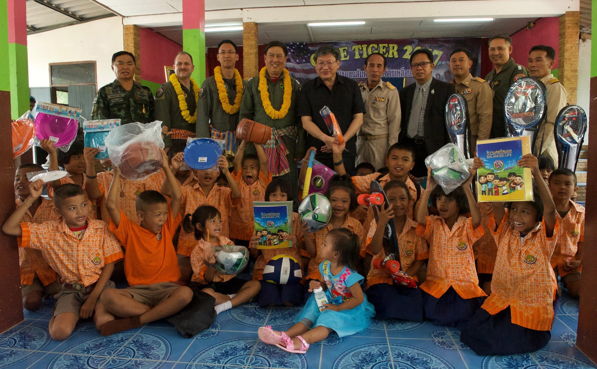 Exercise directors from the Royal Thai air force, Republic of Singapore air force, and U.S. Air Force, along with school and other military officials pose for a photo during the Exercise Cope Tiger 17 (CT17) combined civic action engagement at Ban Tanod Poonpol Witthaya School, Nakhon Ratchasima Province, Thailand, March 22, 2017. The combined civic action engagement provides an outlet for the countries participating in CT17 to give back to the community surrounding Korat Royal Thai Air Force Base. Over 1,200 U.S., Thai and Singaporean military members will participate in this year's annual multilateral exercise which is aimed at improving combined combat readiness and interoperability, while concurrently enhancing the three nations' military relations. (U.S. Air Force photo by Staff Sgt. Kamaile Chan)