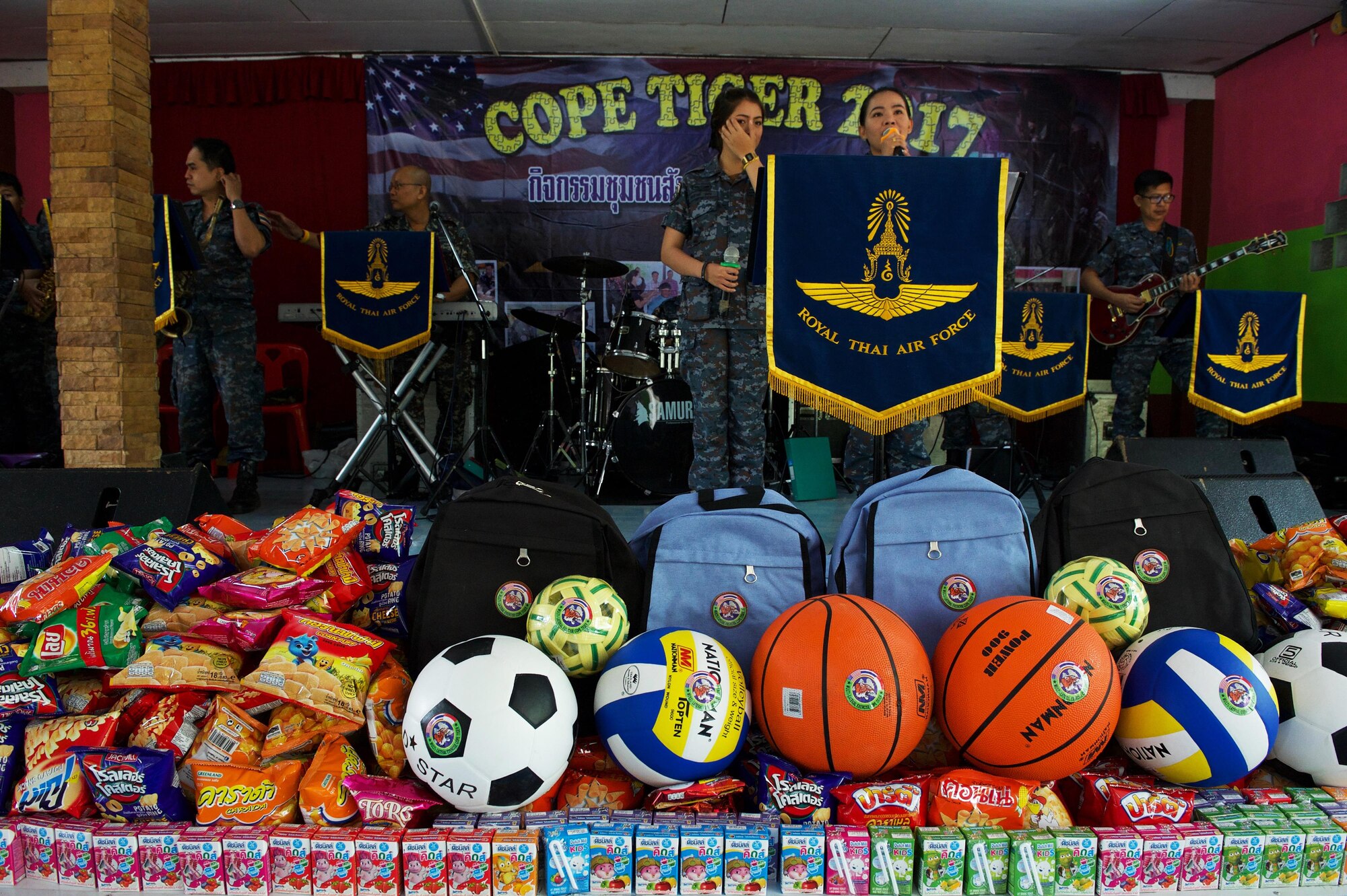 The Royal Thai air force band performs during the Exercise Cope Tiger 17 (CT17) combined civic action engagement at Ban Tanod Poonpol Witthaya School, Nakhon Ratchasima Province, Thailand, March 22, 2017. The combined civic action engagement provides an outlet for the countries participating in CT17 to give back to the community surrounding Korat Royal Thai Air Force Base. This year’s Cope Tiger participants, from the Royal Thai air force, the Republic of Singapore air force, and U.S. Air Force donated a water filtration system to the students as well as books, school supplies and sports equipment. (U.S. Air Force photo by Staff Sgt. Kamaile Chan)