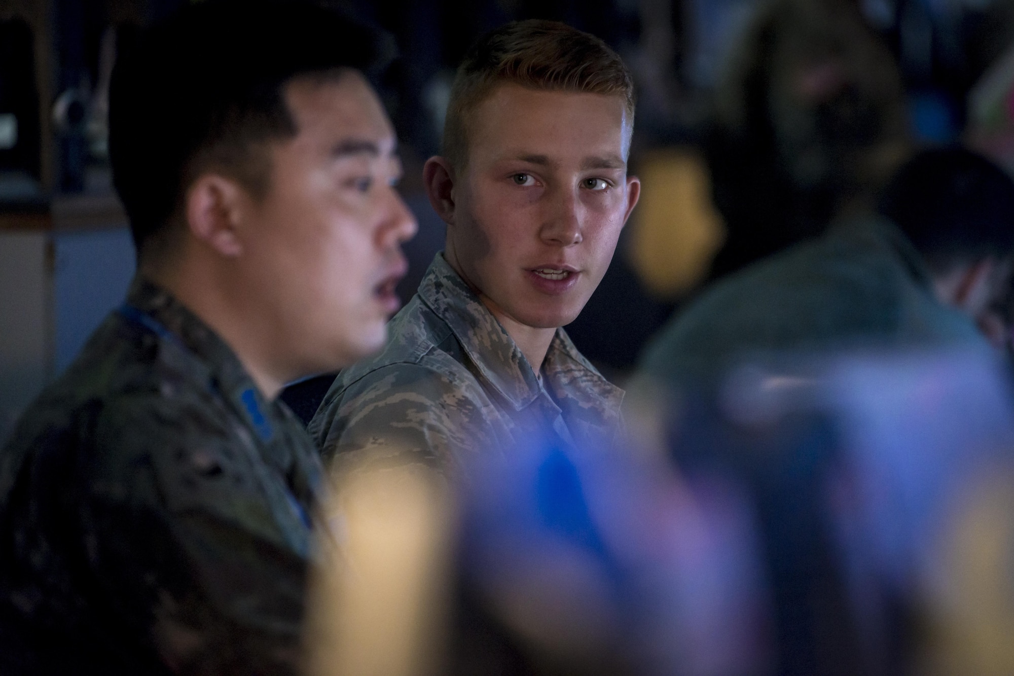 U.S. Air Force Senior Airman Ivan Cooper, right, and Republic of Korea Air Force 1st Lt. Jaewon Yoo with the Osan Weather Squadron, left, discuss the day’s weather before preparing their combined slides and briefing for the general during Key Resolve at Osan Air Base, Republic of Korea, March 20, 2017. Weather forecasts are critical as countless factors can contribute to the outcome of a mission. Weather specialists keep a constant watch over the forecast and conditions that can affect the safety of pilots and aircrew. These experts utilize the latest technology to predict weather patterns, prepare forecasts and communicate weather information to commanders and pilots so that every mission goes as planned. Cooper is with the 15th Operations Support Squadron at Joint Base Pearl Harbor-Hickam, Hawaii. (U.S. Air Force photo by Staff Sgt. Benjamin W. Stratton)
