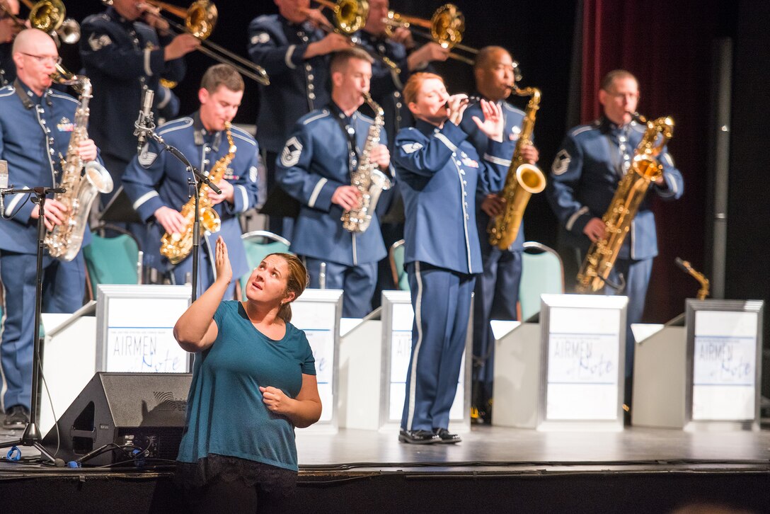 The Airmen of Note had an incredibly warm reception the evening of March 9 performing at Gallaudet University Theatre. The University has become a beacon by designing a barrier-free learning environment for deaf and hard of hearing students. Here,an ASL interpreter seamlessly signed alongside the band.  (US Air Force photos/MSgt Jim DeVaughn/released)