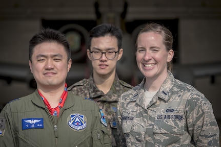 Republic of Korea Air Force Capt. Sangbo Min, a search and rescue duty officer, left, and ROKAF Senior Airman Seung Hwan Kowith, an interpreter, center, both with the ROKAF Airlift and Rescue Branch, pose for a photo with U.S. Air Force 1st Lt. Mary Daughenbaugh, right, with the 566th Intelligence Squadron at Buckley Air Force Base, Colorado, during Key Resolve 2017 at Osan Air Base, Republic of Korea, March 21, 2017. These Airmen work side-by-side with other combat search and rescue specialists participating in the annual command and control exercise called Key Resolve. (U.S. Air Force photo by Staff Sgt. Benjamin W. Stratton)