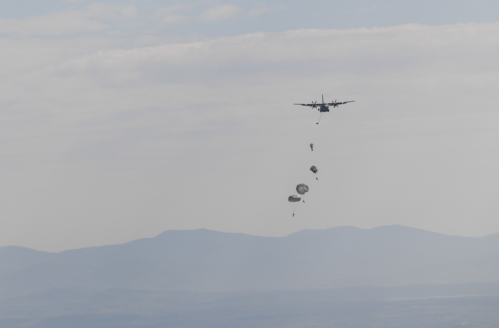 Bulgarian paratroopers descend from an Alenia C-27J Spartan during Exercise Thracian Spring 17 at Plovdiv Regional Airport, Bulgaria, March 20, 2017. Airmen from the 37th Airlift Squadron, 435th Contingency Response Group, and 86th Airlift Wing, Ramstein Air Base, Germany, partnered with the Bulgarian military for the two-week exercise. The U.S. shares a commitment with Bulgaria, a NATO ally, to promote peace and close cooperation on countering a range of regional and global threats. (U.S. Air Force photo by Staff Sgt. Nesha Humes)