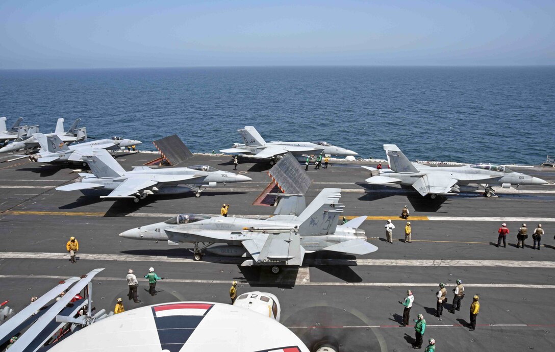 170320-N-GI441-021 
U.S. 5TH FLEET AREA OF OPERATIONS (March 20, 2017) Sailors prepare an F/A-18E Super Hornets for launch aboard the aircraft carrier USS George H.W. Bush (CVN 77). The ship and its carrier strike group are deployed in support of maritime security operations and theater security efforts in the U.S. 5th Fleet area of operations. (U.S. Navy photo by Mass Communication Specialist 3rd Class Brianna Bowens/Released)