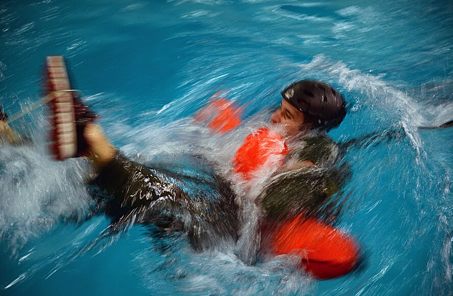 A U.S. Air Force Airman gets pulled through the water during Water Survival Training March 10, 2017, at Lowestoft College, Maritime and Offshore Facilities, England. This exercise focused on what it would be like being pulled through the water if attached to a parachute and how to escape. (U.S. Air Force photo by Senior Airman Christine Halan)