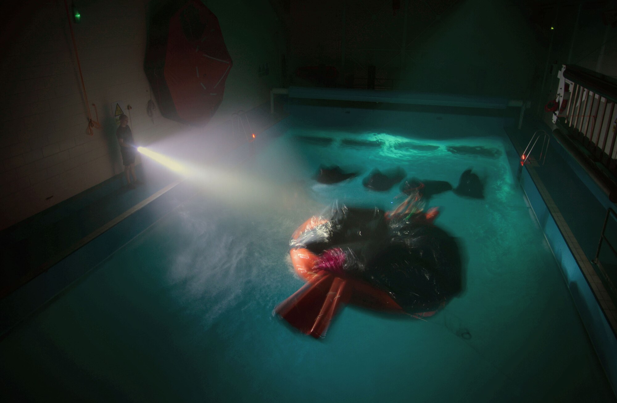 U.S. Air Force Airmen undergo an exercise during Survival, Evasion, Resistance and Escape Water Survival Training March 10, 2017, at Lowestoft College, Maritime and Offshore Facilities, England. Once Airmen are instructed on how to properly survive in the water, they’re put through an exercise to test their survival skills. (U.S. Air Force photo by Senior Airman Christine Halan)