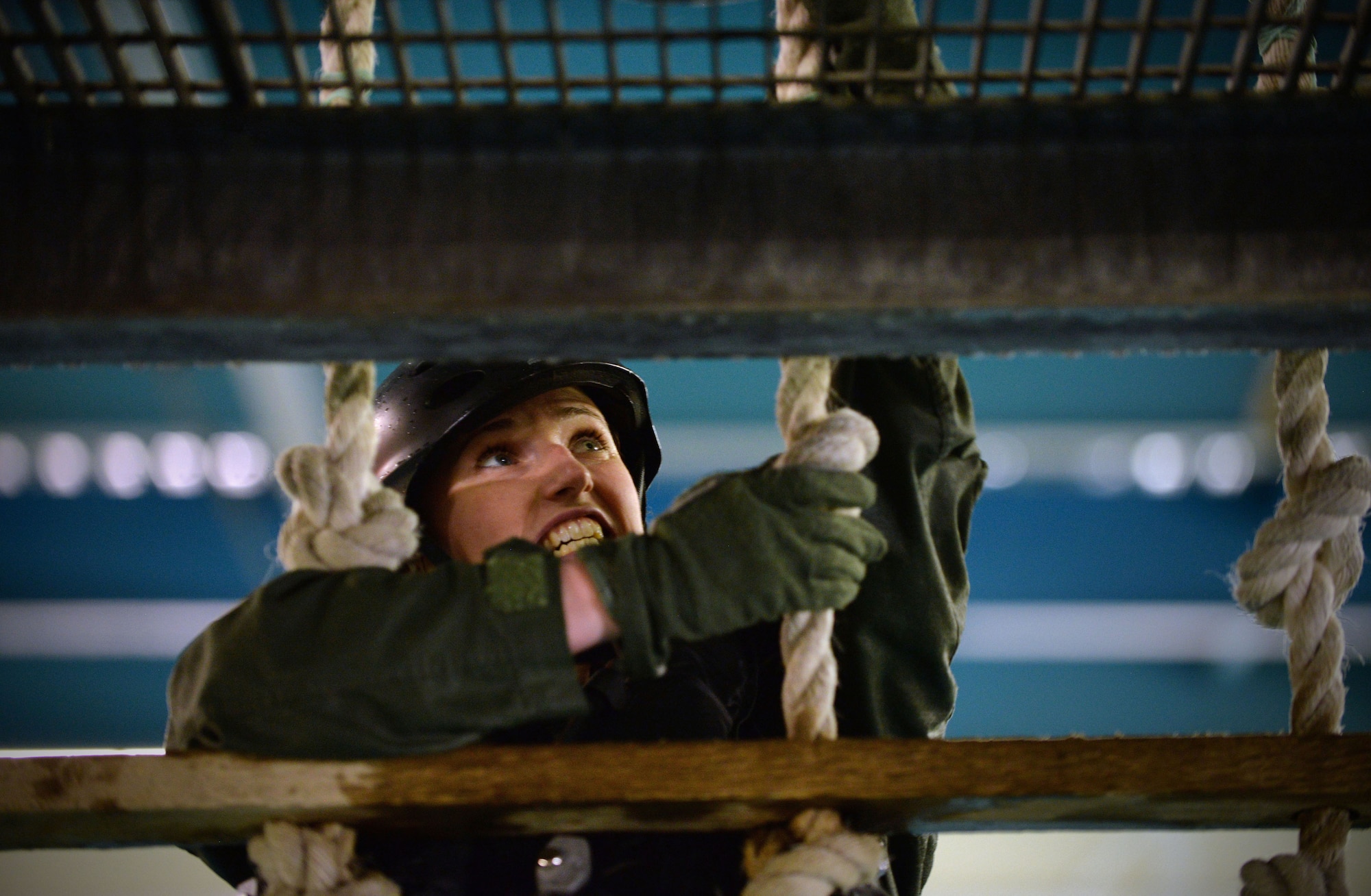 A U.S. Air Force Airman from the 48th Fighter Wing, RAF Lakenheath, England, climbs up a cargo net ladder March 10, 2017, at Lowestoft College, Maritime and Offshore Facilities, England. Airmen from the 352nd Special Operations Wing, 48th FW and 100th Air Refueling Wing underwent water survival training as part of their three-year refresher course. (U.S. Air Force photo by Senior Airman Christine Halan)