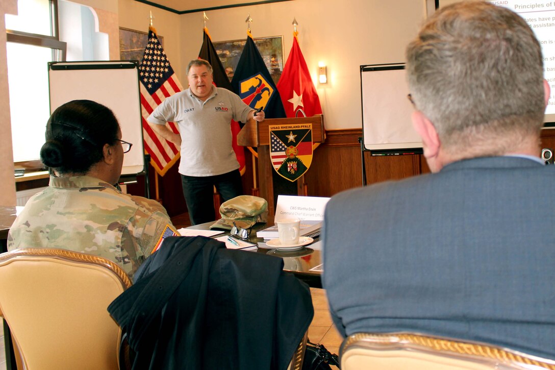 Dana Chivers, an advisor to European Command for U.S. Agency for International Development and the Office of U.S. Foreign Disaster Assistance, speaks to 7th Mission Support Command personnel during the Diplomacy at Work Professional Development Workshop March 22 at the Armstrong Club on Vogelweh Air Force Base.