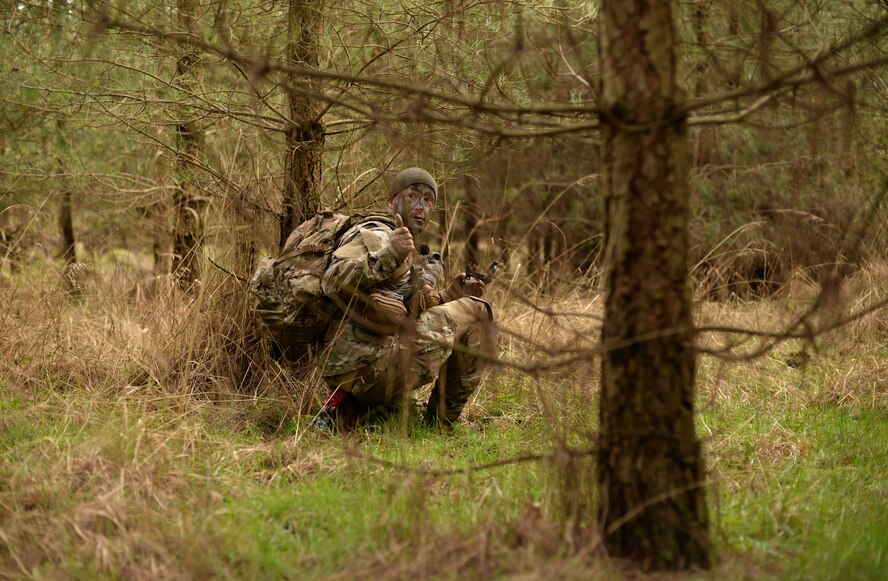 A U.S Air Force Air Commando from the 352nd Special Operations Wing gives a thumbs up during a field training exercise, March 8, 2016, at the Stanford Training Area, England. Airmen were instructed on how to properly survive, evade, resist and escape if taken by captors. (U.S. Air Force photo by Senior Airman Christine Halan)