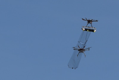 An attack drone with attached net, part of the counter-unmanned aerial system developed by a team from Wright-Patterson Air Force Base, Ohio, intercepts a DJI S1000 drone with its net during the 2016 Air Force Research Laboratory Commanders Challenge at the Nevada National Security Site in Las Vegas, Dec. 13, 2016. Teams had six months to develop a counter-unmanned aerial system to aid in base defense. At a CSIS meeting on space security on March 22, 2017, Navy Vice Adm. Charles A. Richard, deputy commander of U.S. Strategic Command, said space enables all domains and tools of warfare, including ships, jets, missiles and drones. Air Force photo by Wesley Farnsworth