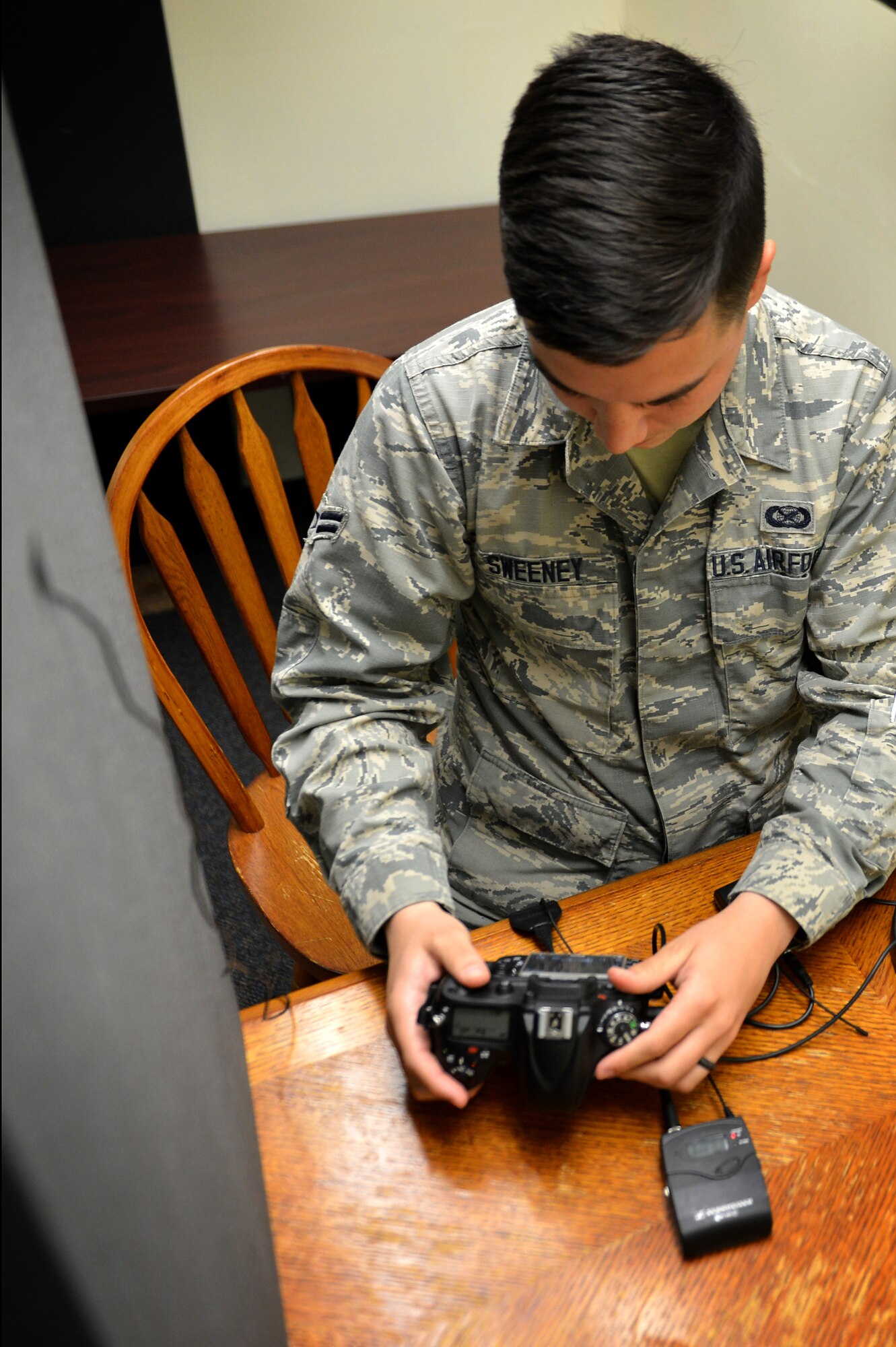 U.S. Air Force Airman 1st Class Seán Sweeney, 20th Fighter Wing (FW) Public Affairs (PA) broadcast journalist journeyman, monitors audio levels before recording a promotional radio announcement at the 20th FW PA office at Shaw Air Force Base, S.C., March 21, 2017. Broadcast journalists communicate through the use of audiovisual productions, intended to inform and educate local and military outlets about base operations, while preserving Air Force history. (U.S. Air Force photo by Airman 1st Class Christopher Maldonado) 